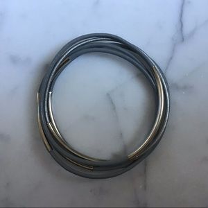 Grey leather bracelets set with silver band